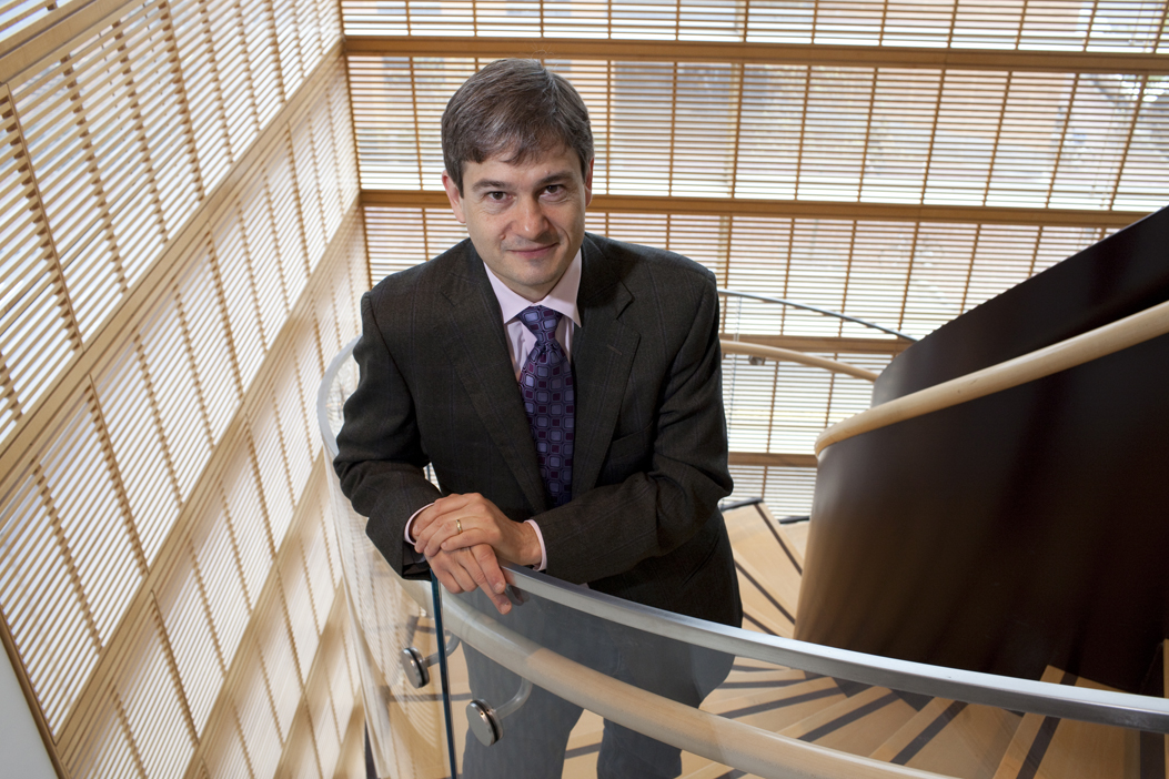 Stephan Ansolabehere stands in a stairwell looking up