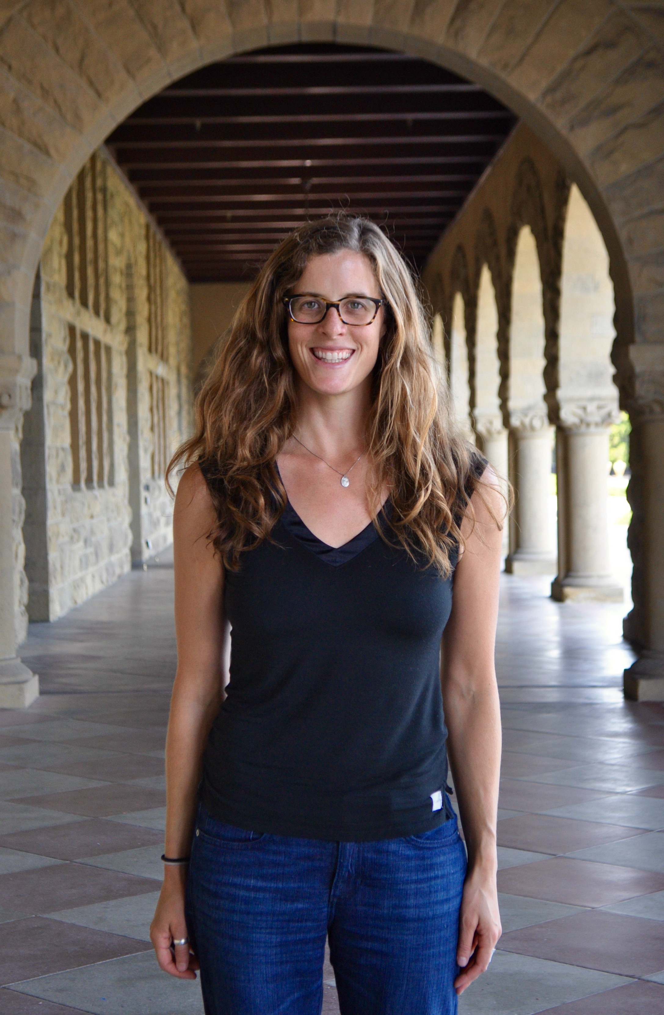 Lauren Oakes stands in an archway