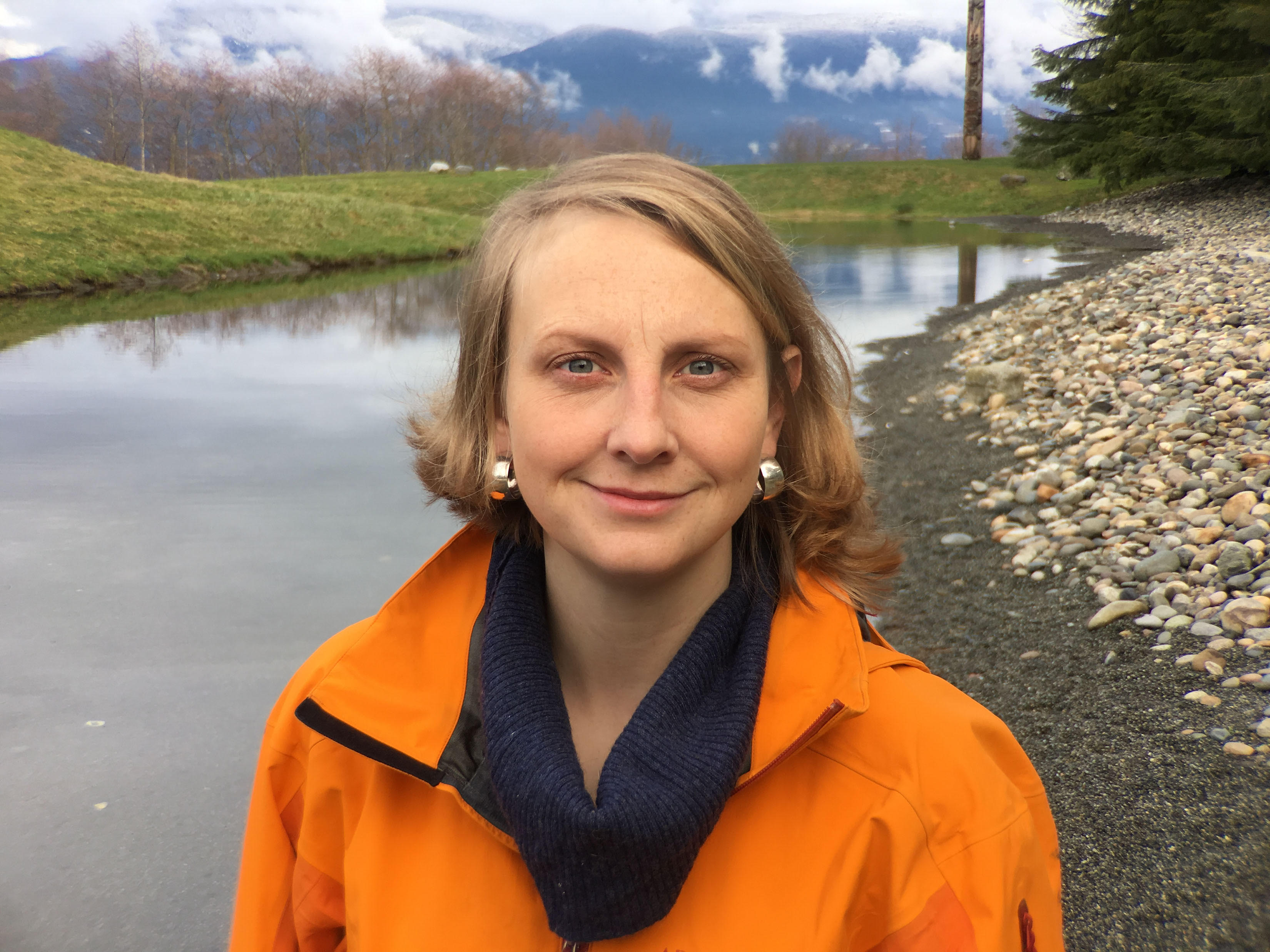 Jennifer Sunday stands in front of a river