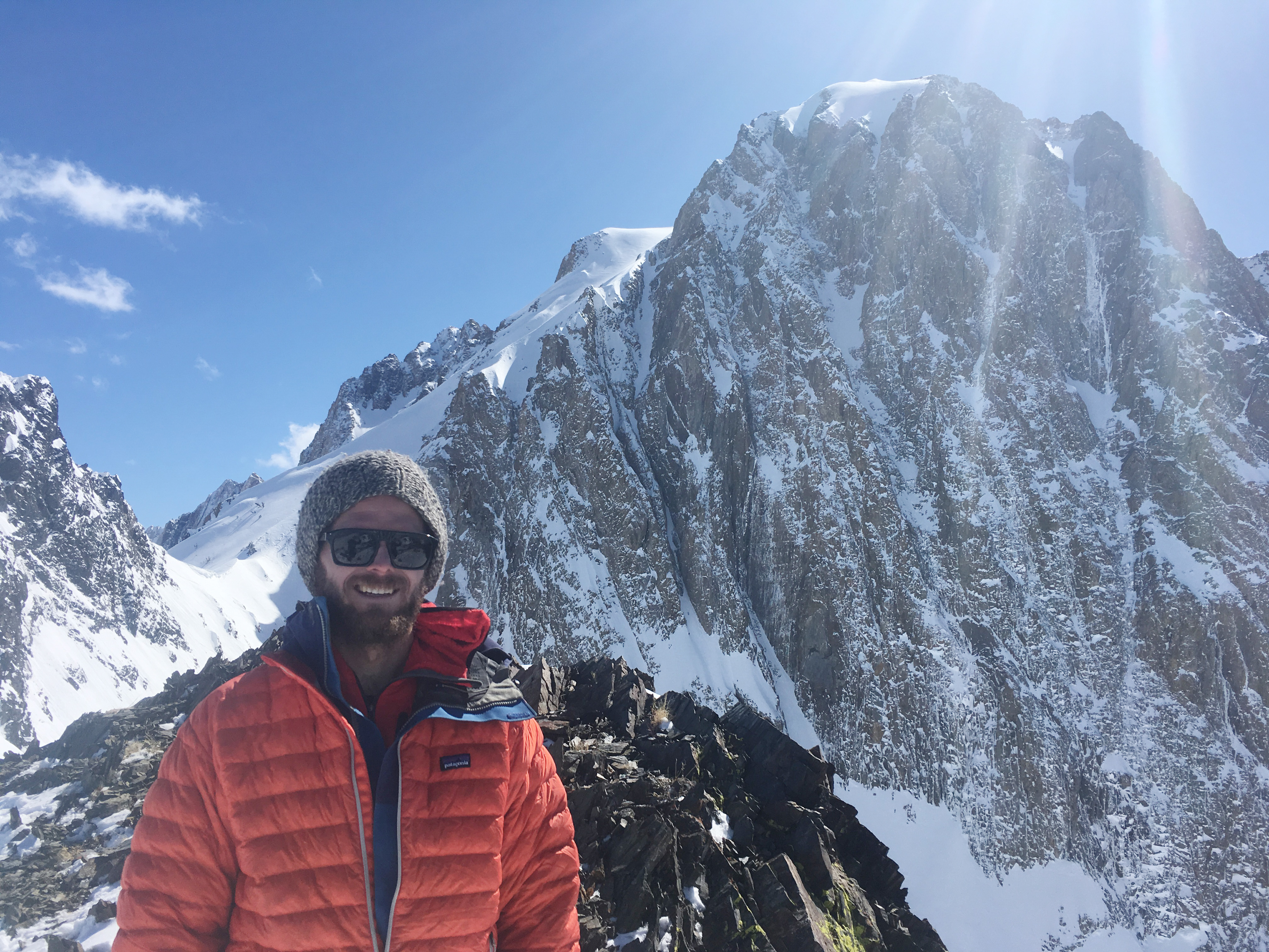 Timbo Stillinger stands on a snowy mountain