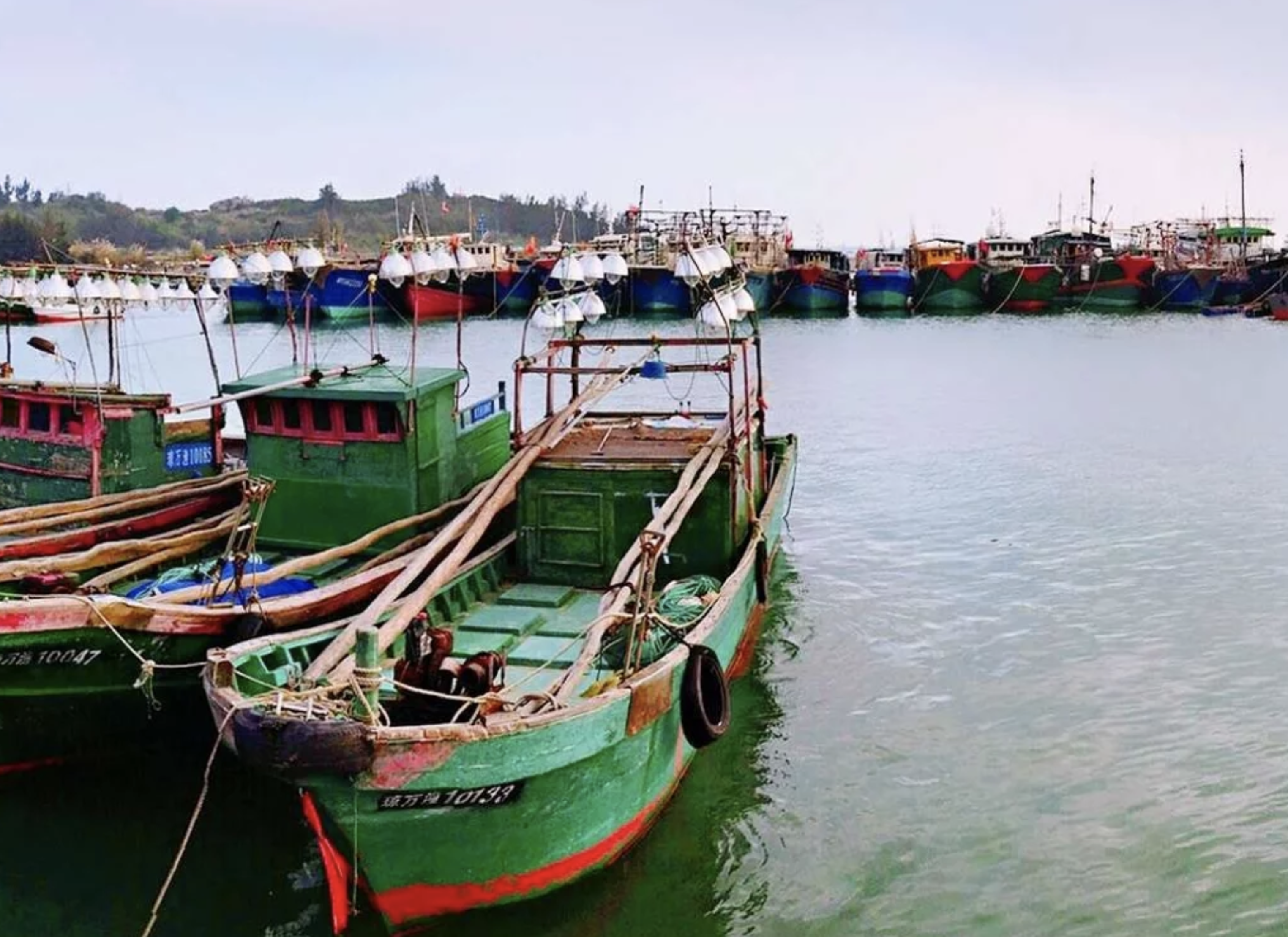 Rustic fishing boats in a harbor.