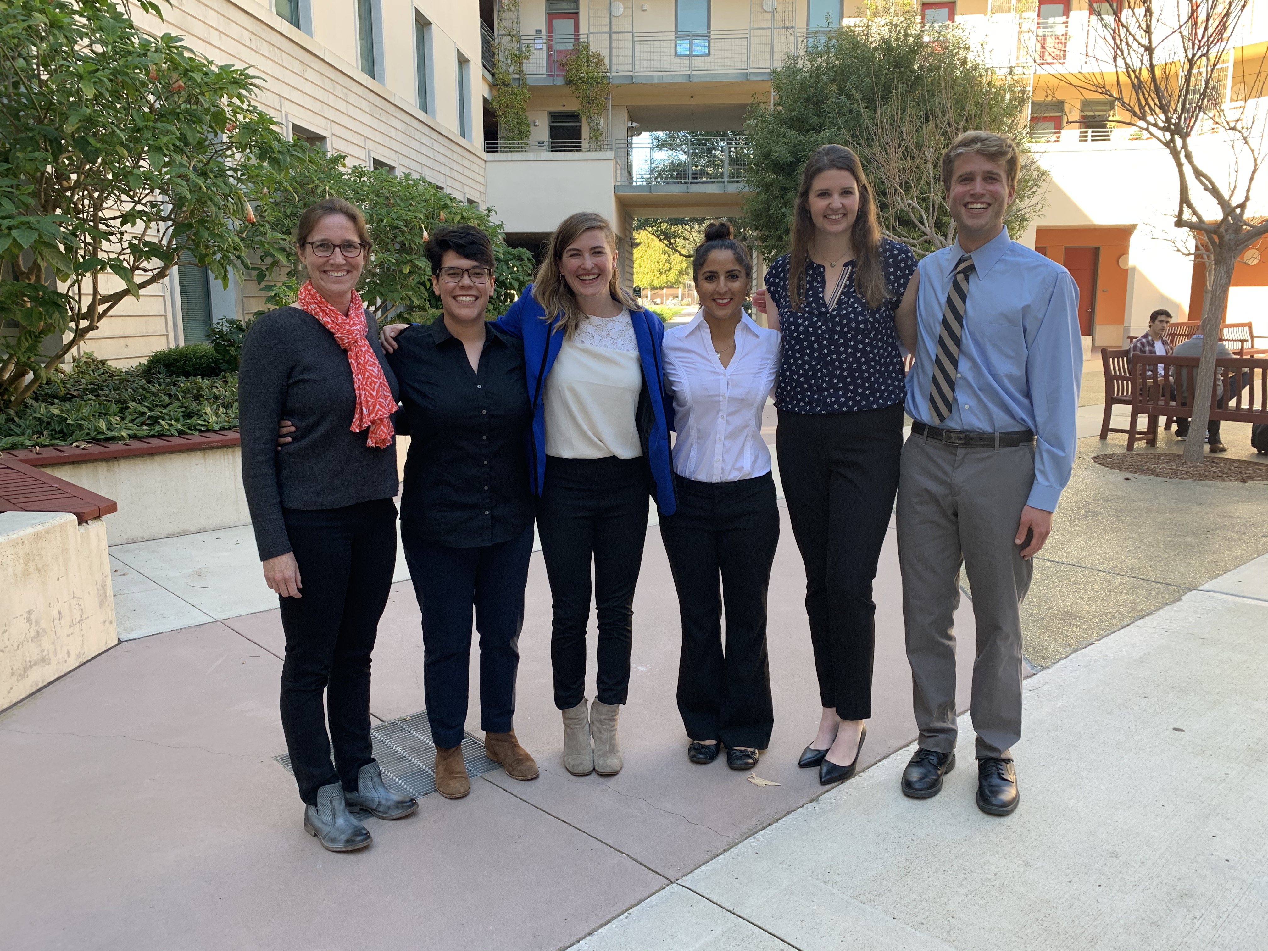 Five students and faculty mentors posing for a photo