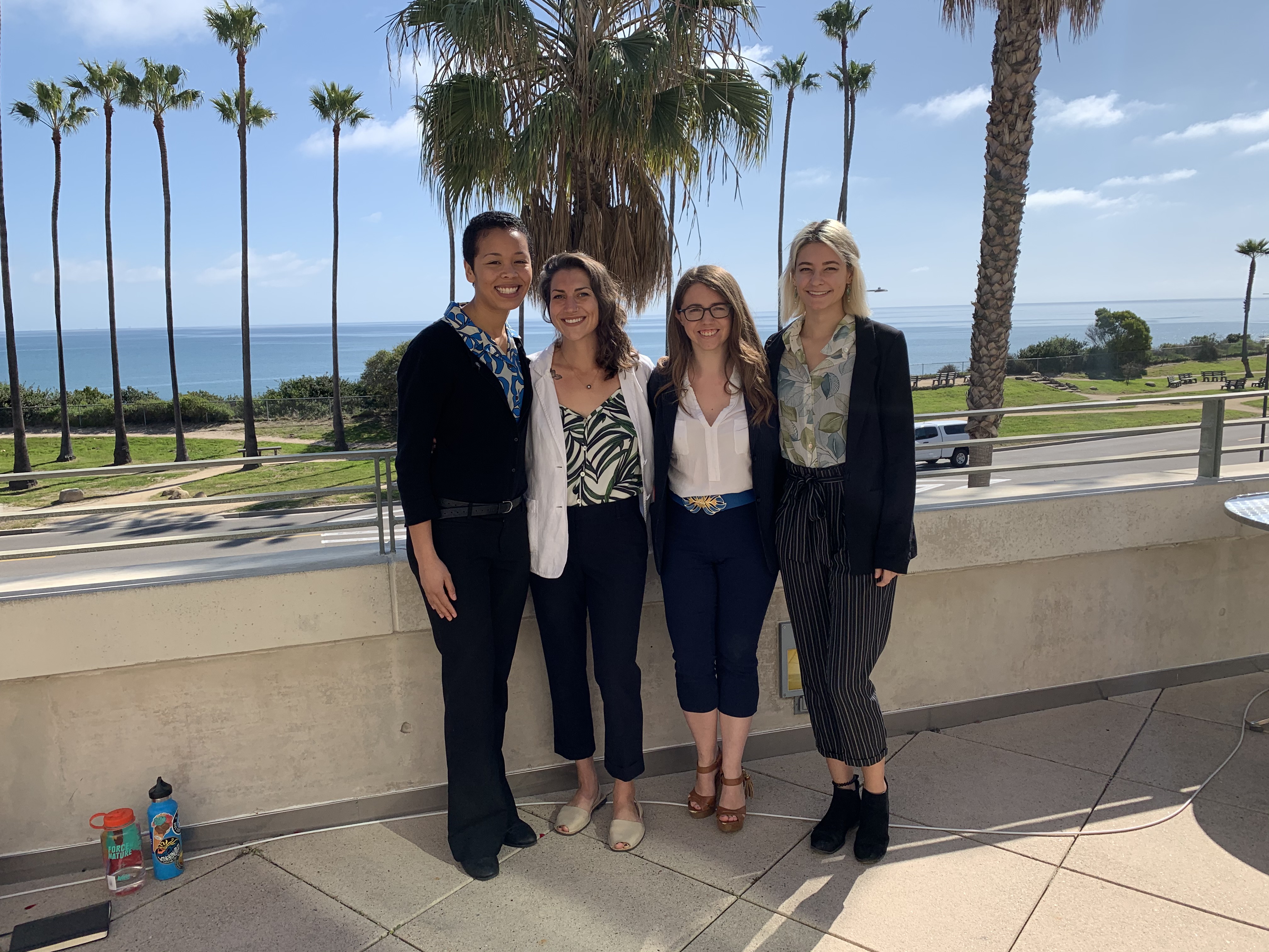 Group of four students smiling