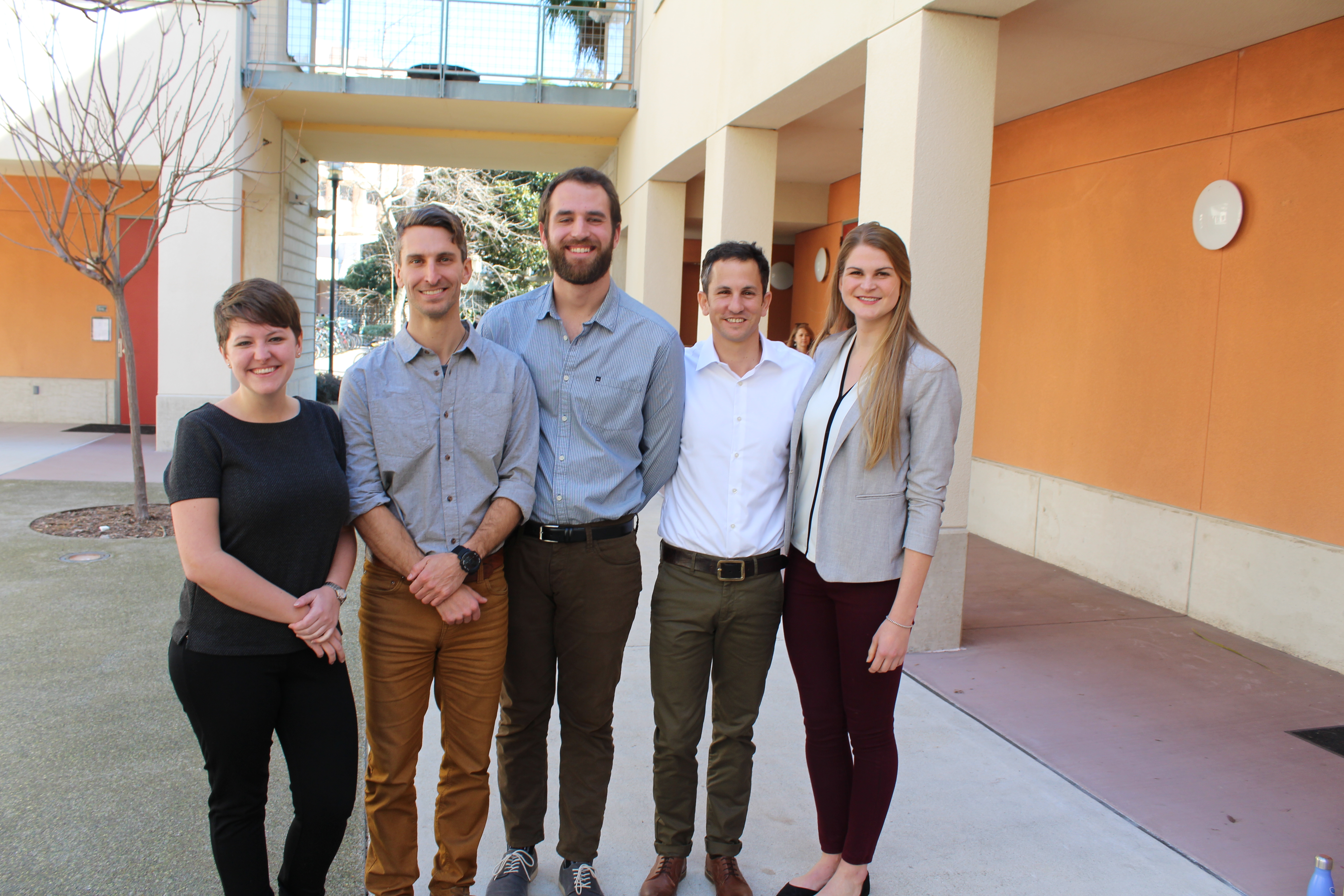 Group of five students posing together