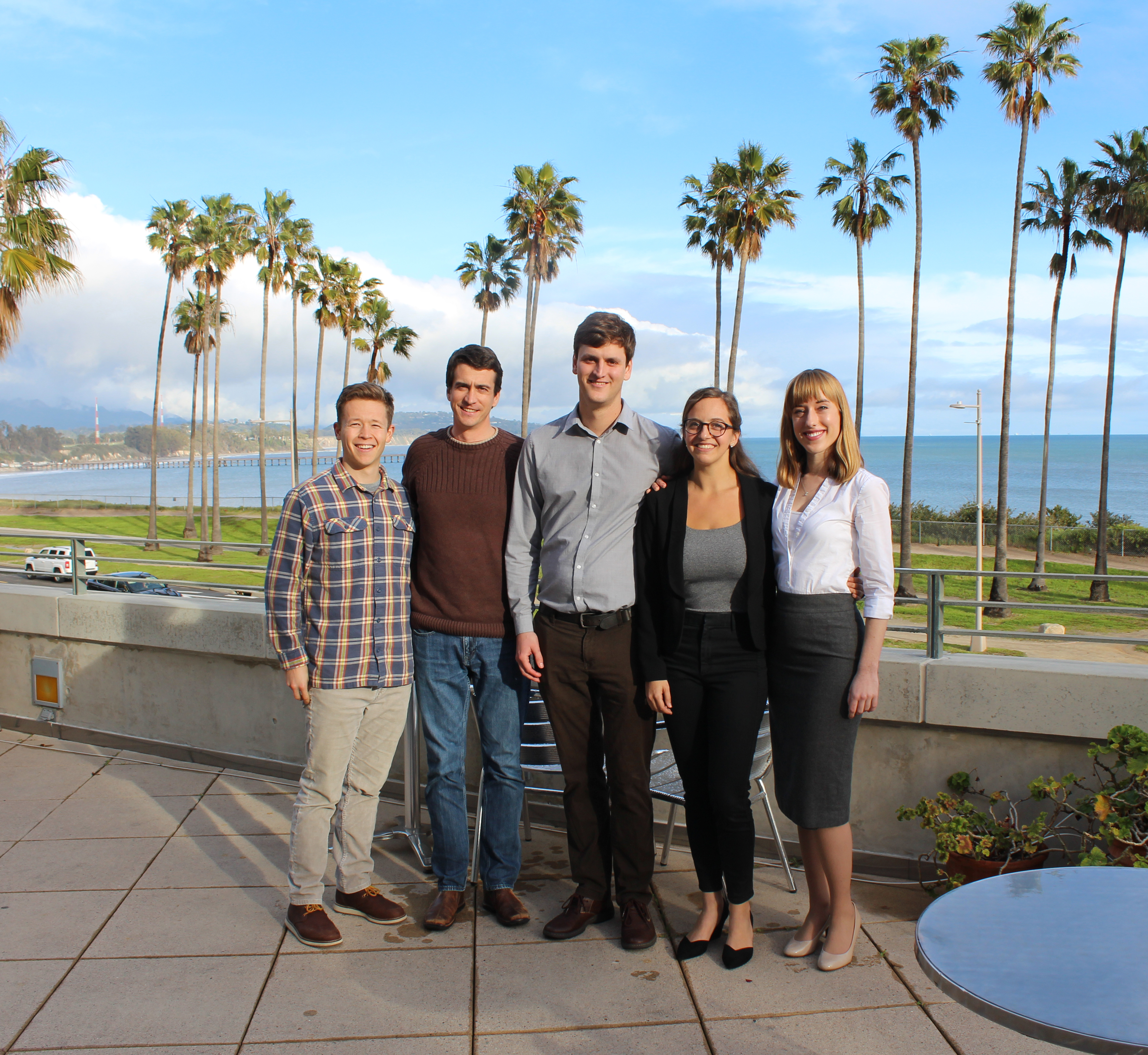 Group of five students posing together