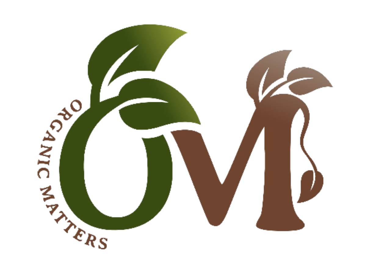 business logo O and M with leaf art