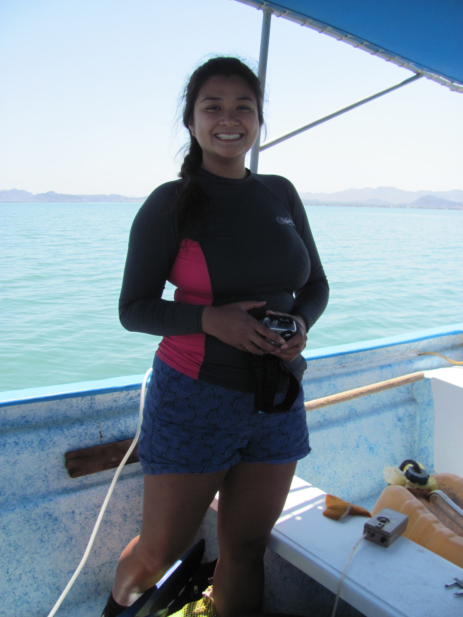 Nicole Corpuz stands on a boat