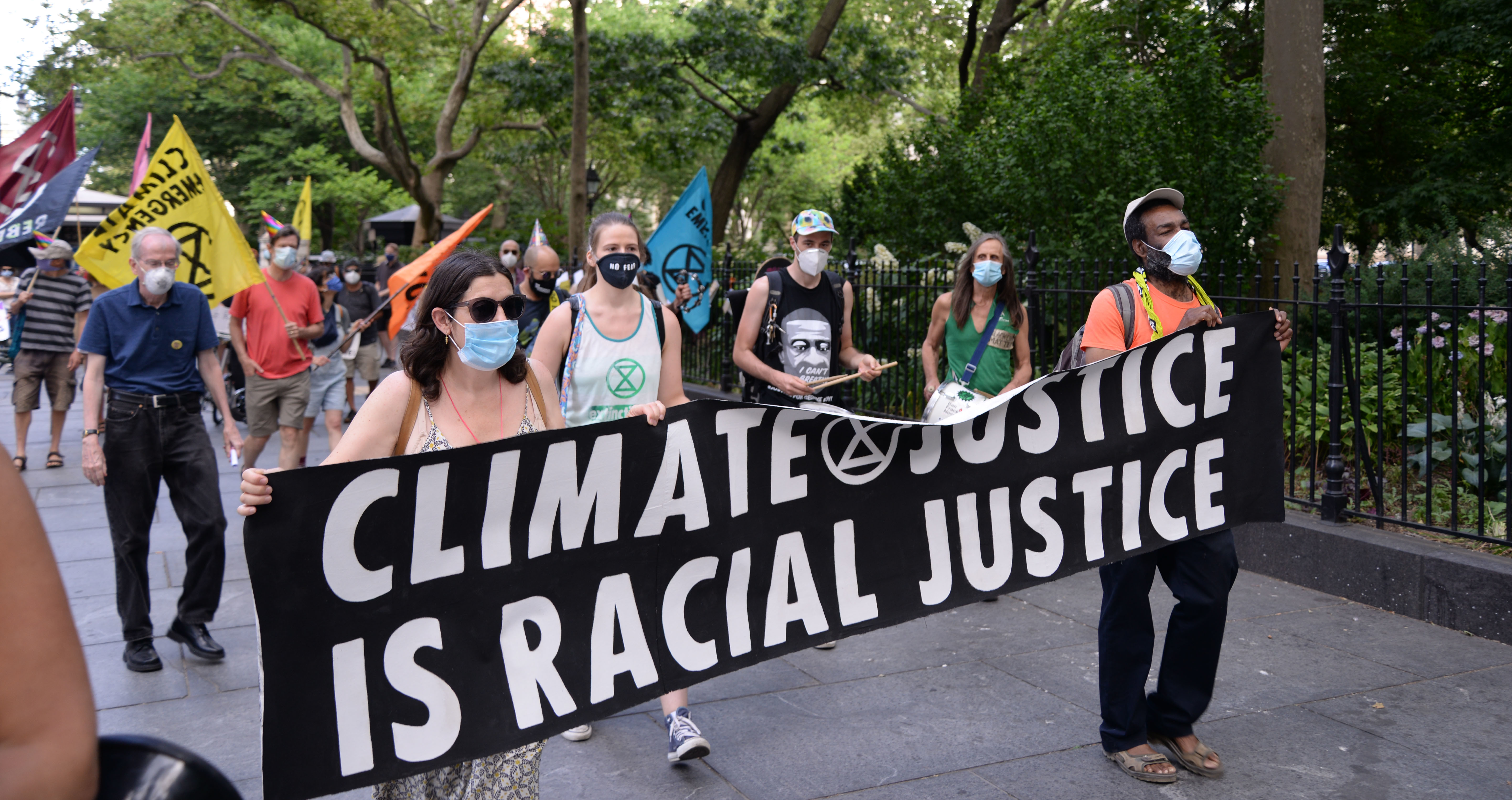 Climate justice march holding banner