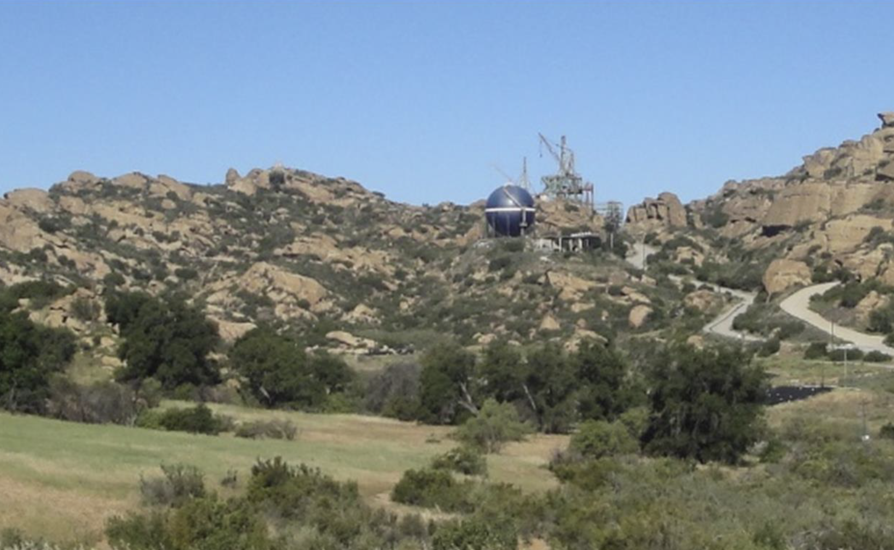 Building sitting in rocky foothills