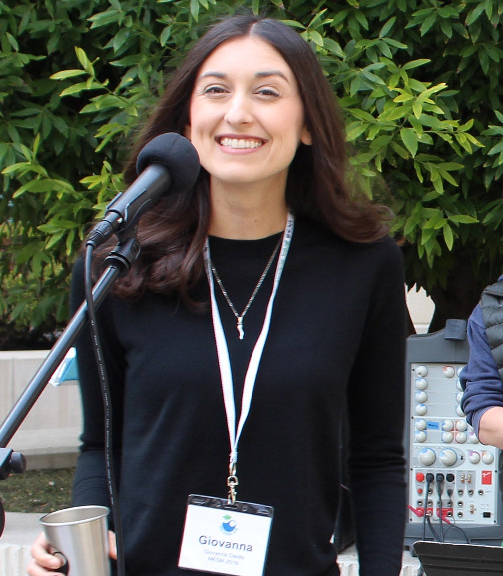 woman singing at mic