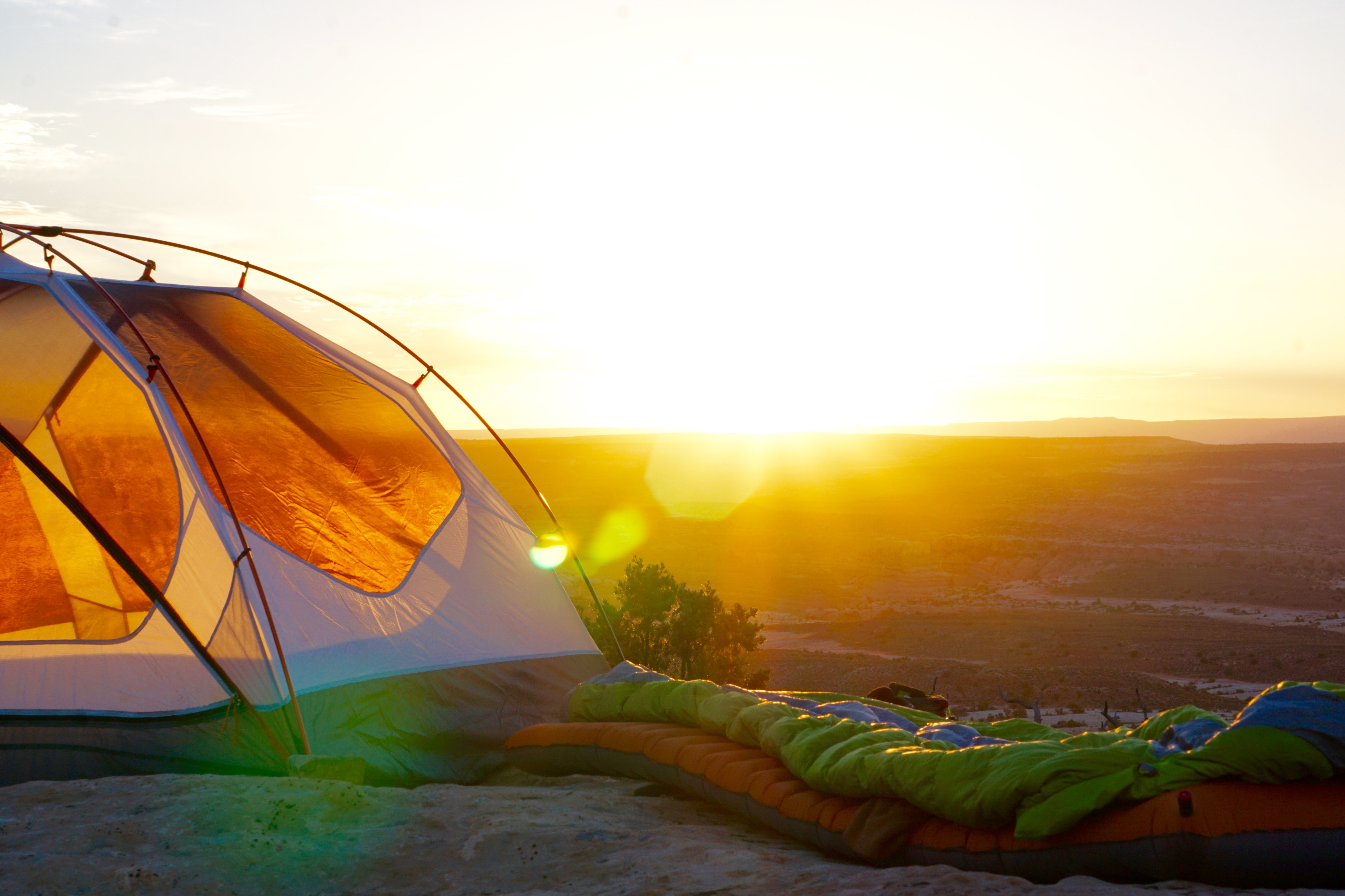 Tent perched on cliff overlooking national park