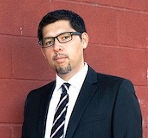 headshot of man in suit