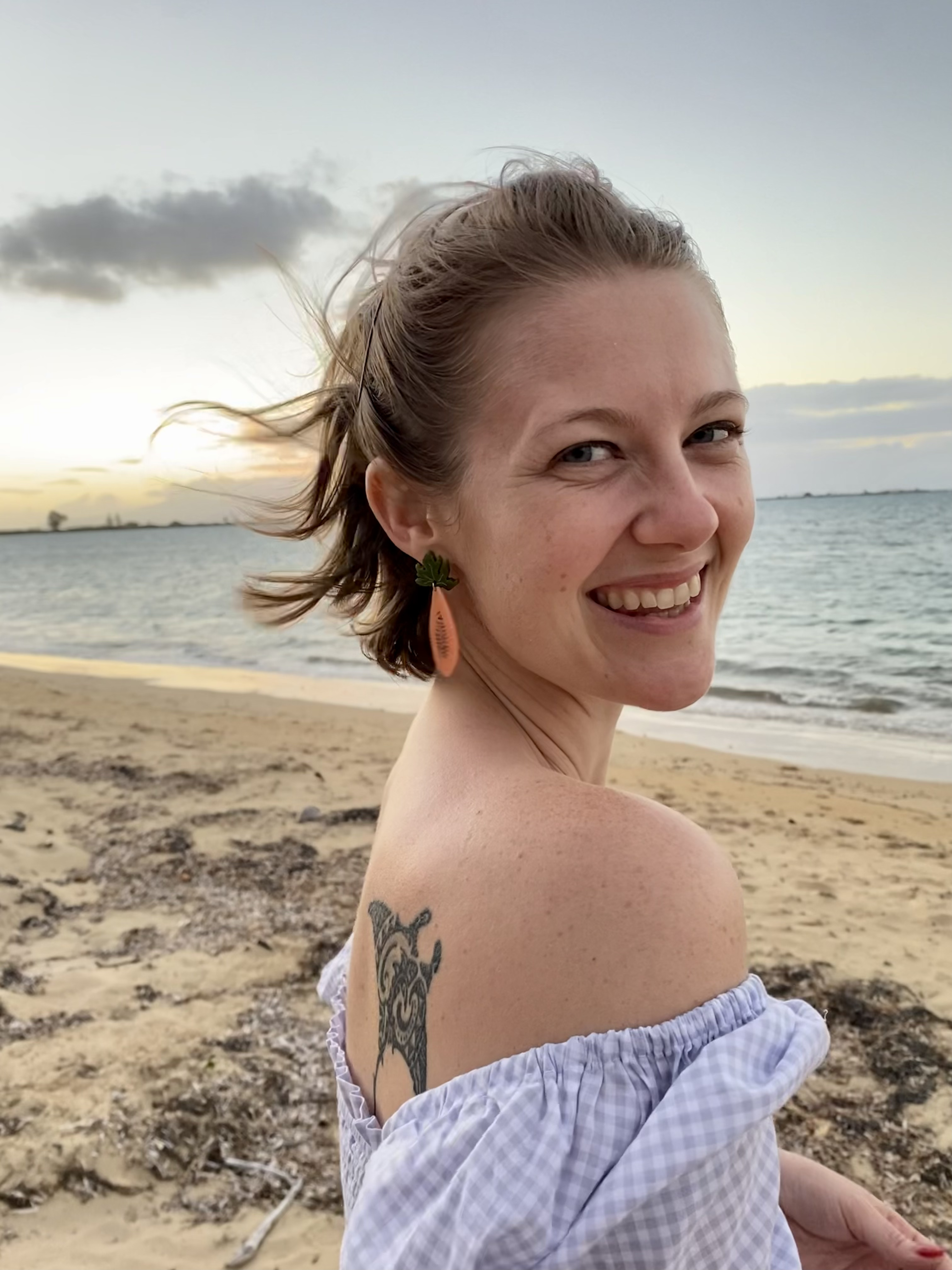 Caroline Ferguson stands on a beach