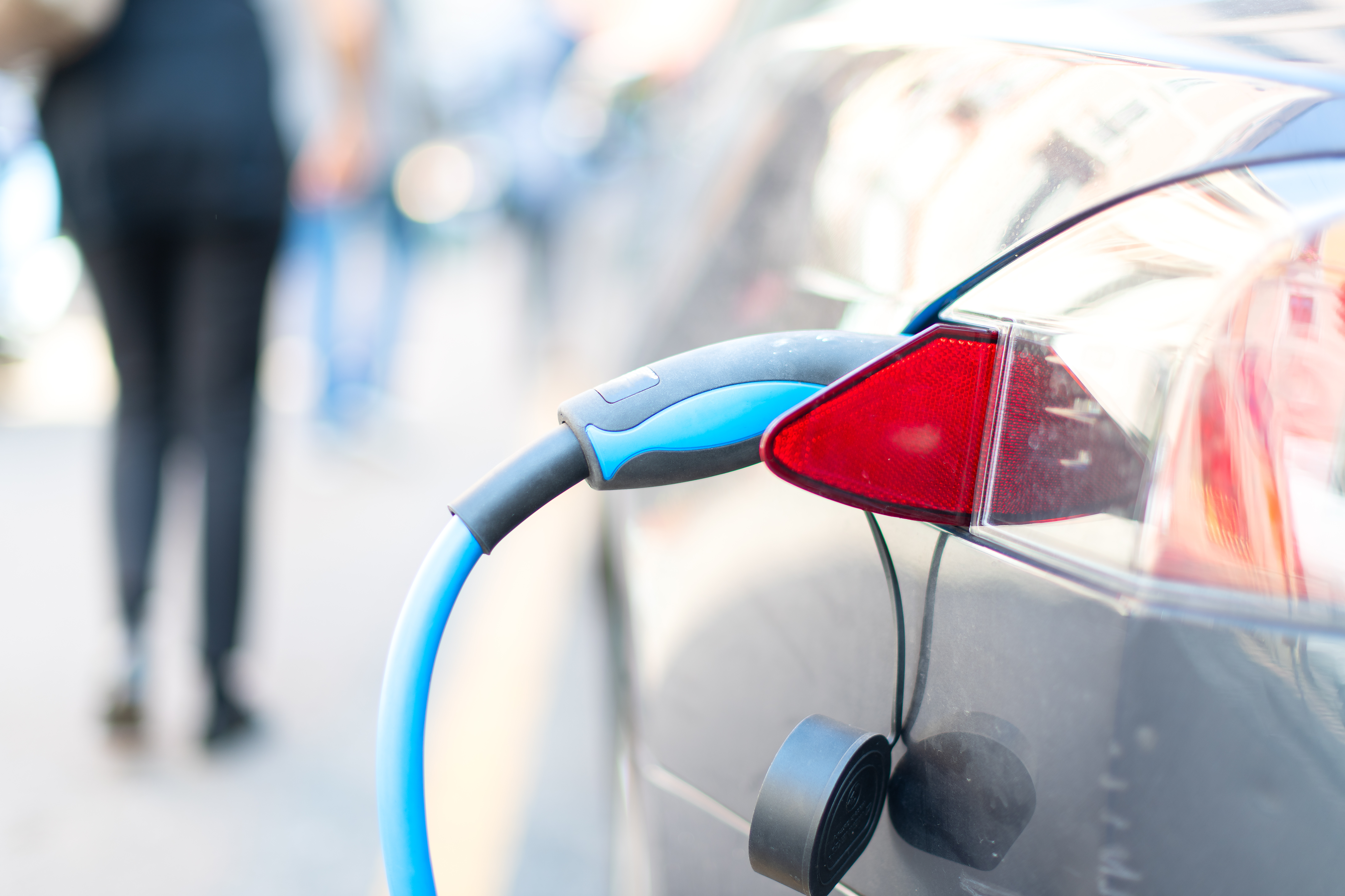 electric car is plugged in to charge