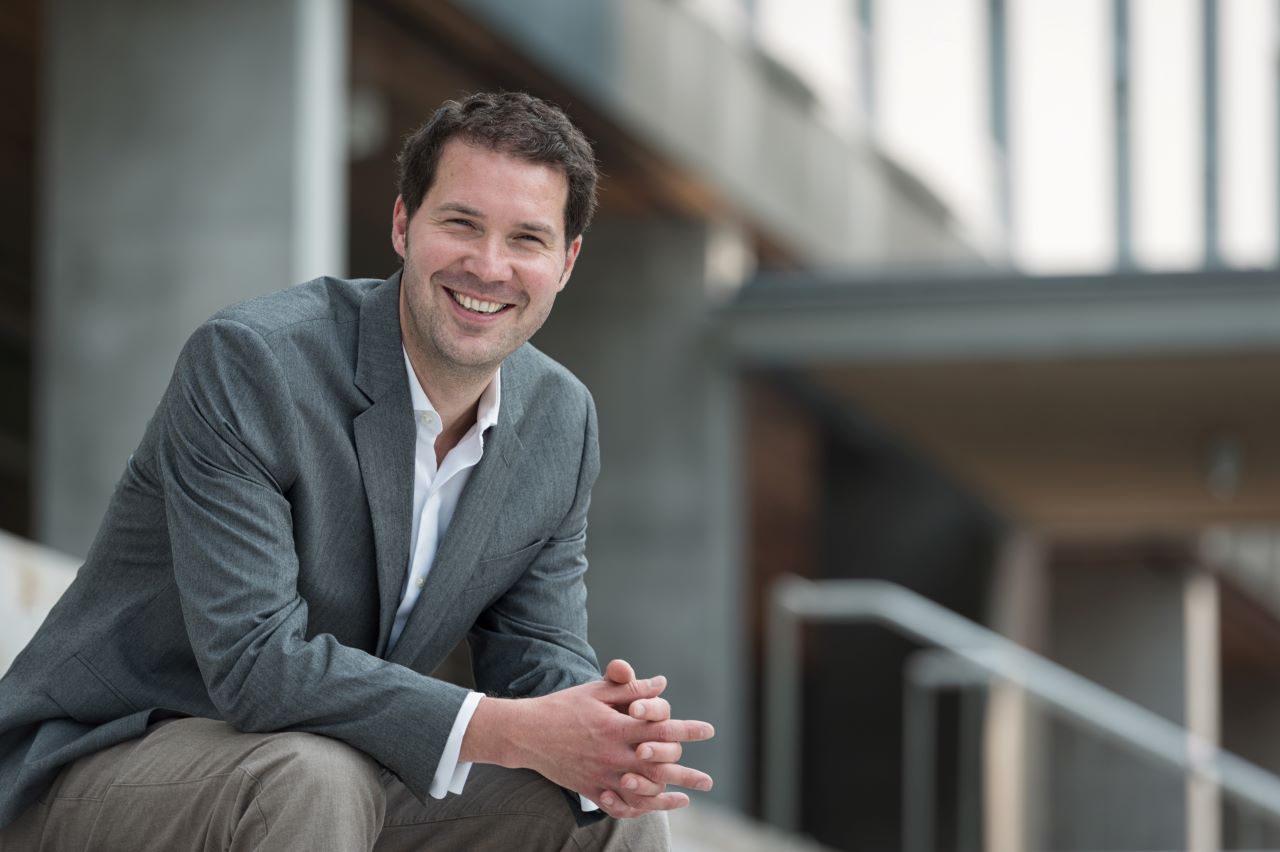 Frederik Noack sits on steps outside