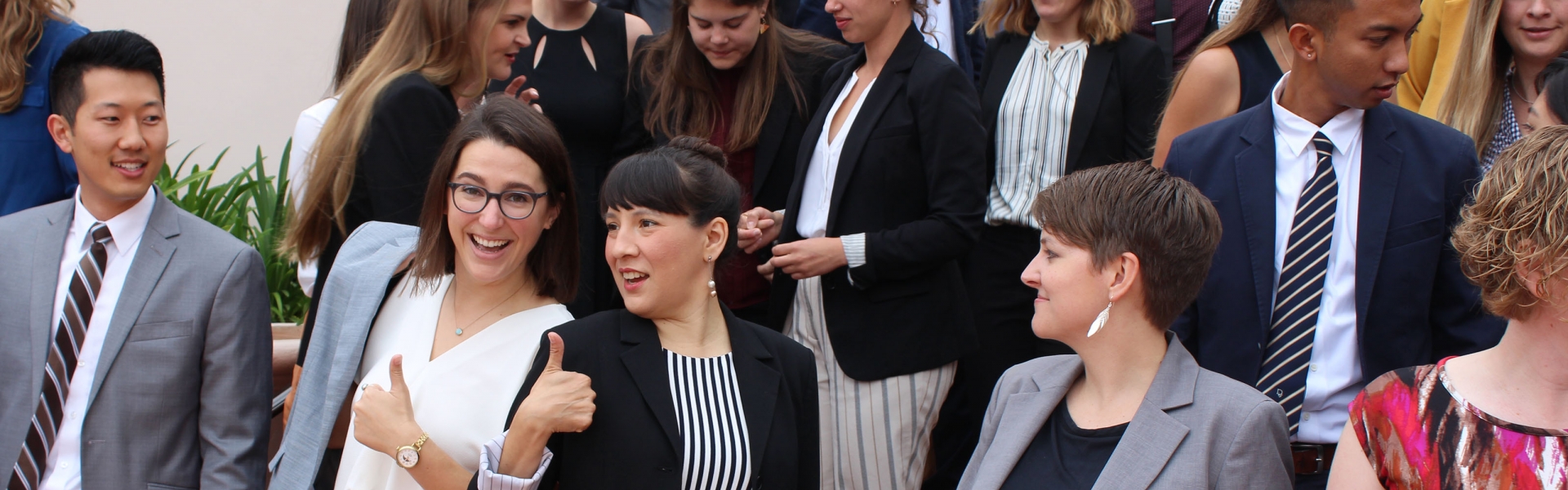 Well dressed students gather for a cohort photo