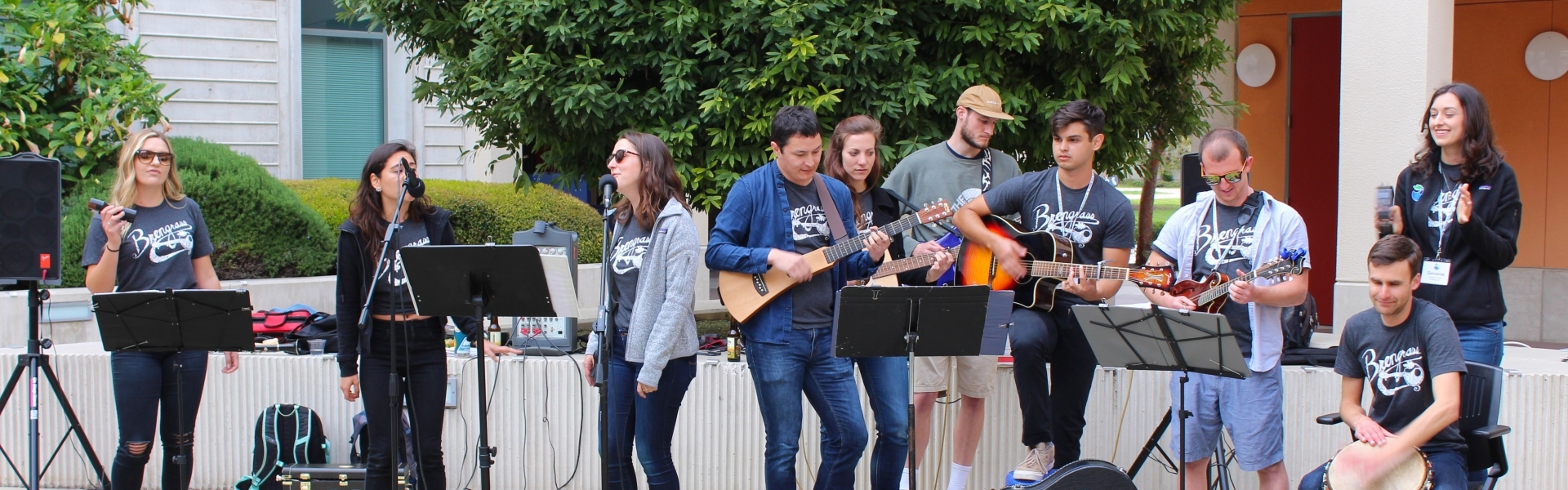 Ten or so students playing instruments in a band 