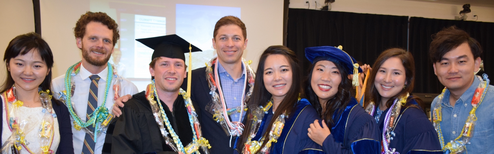 Group of PhD grads pose for graduation photo