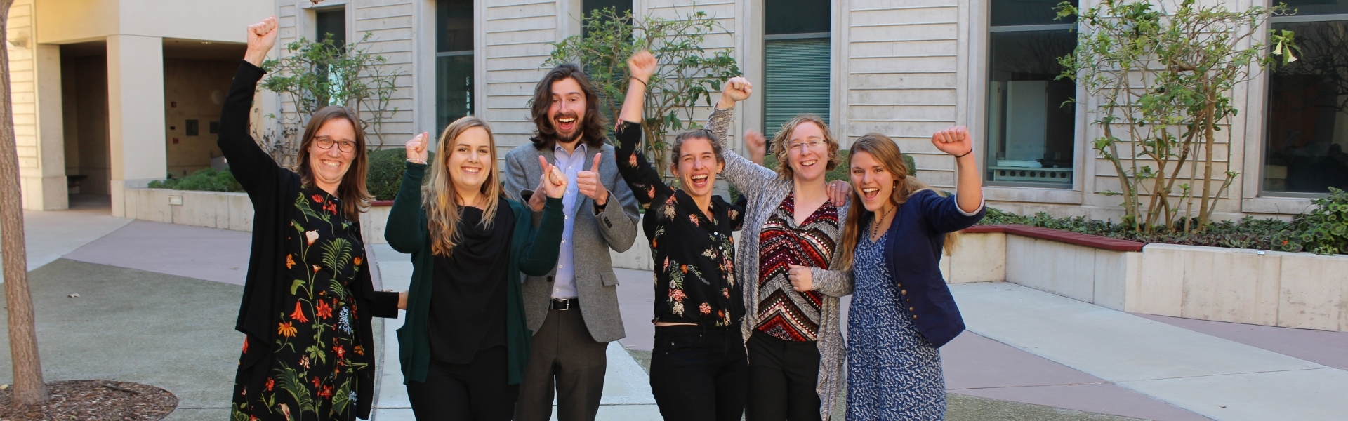 Six people cheering 