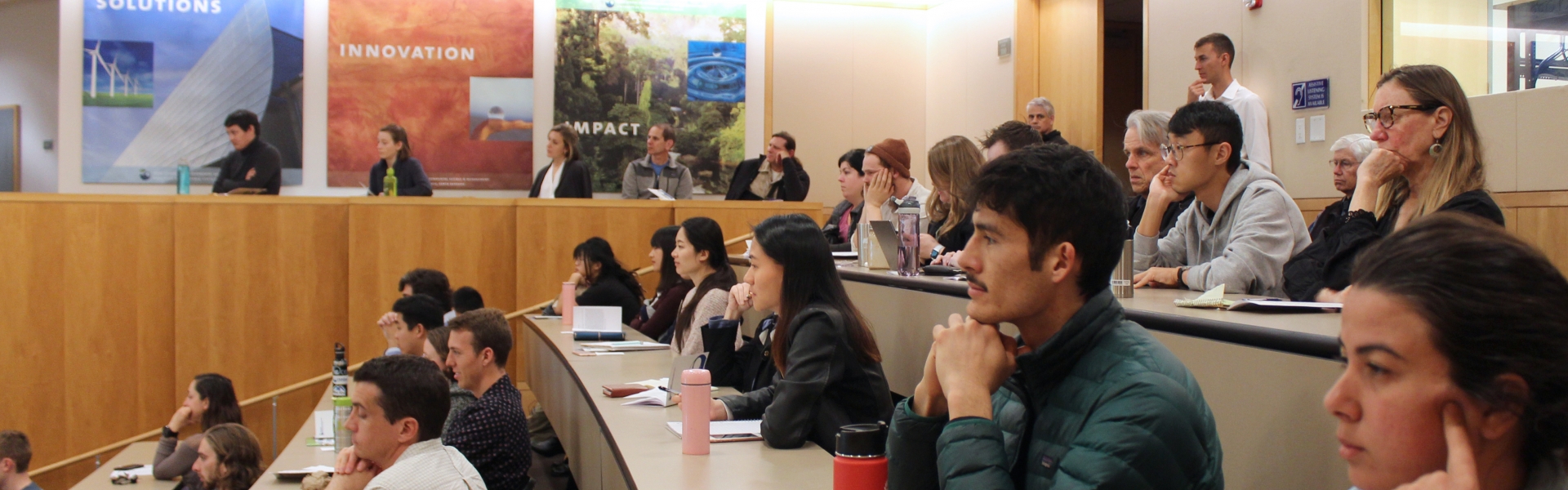 Students focused on speaker in lecture hall