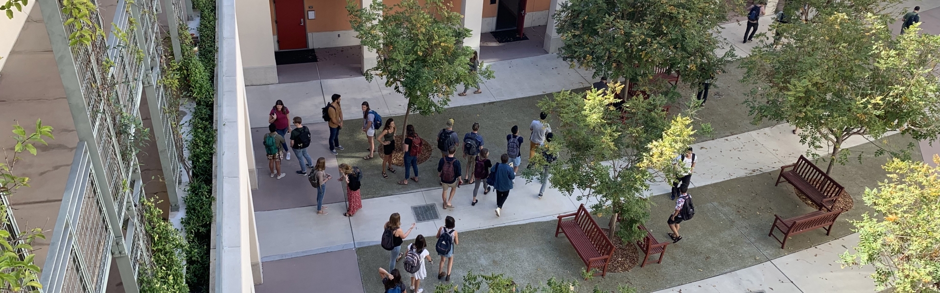 View from top floor of students milling about in courtyard