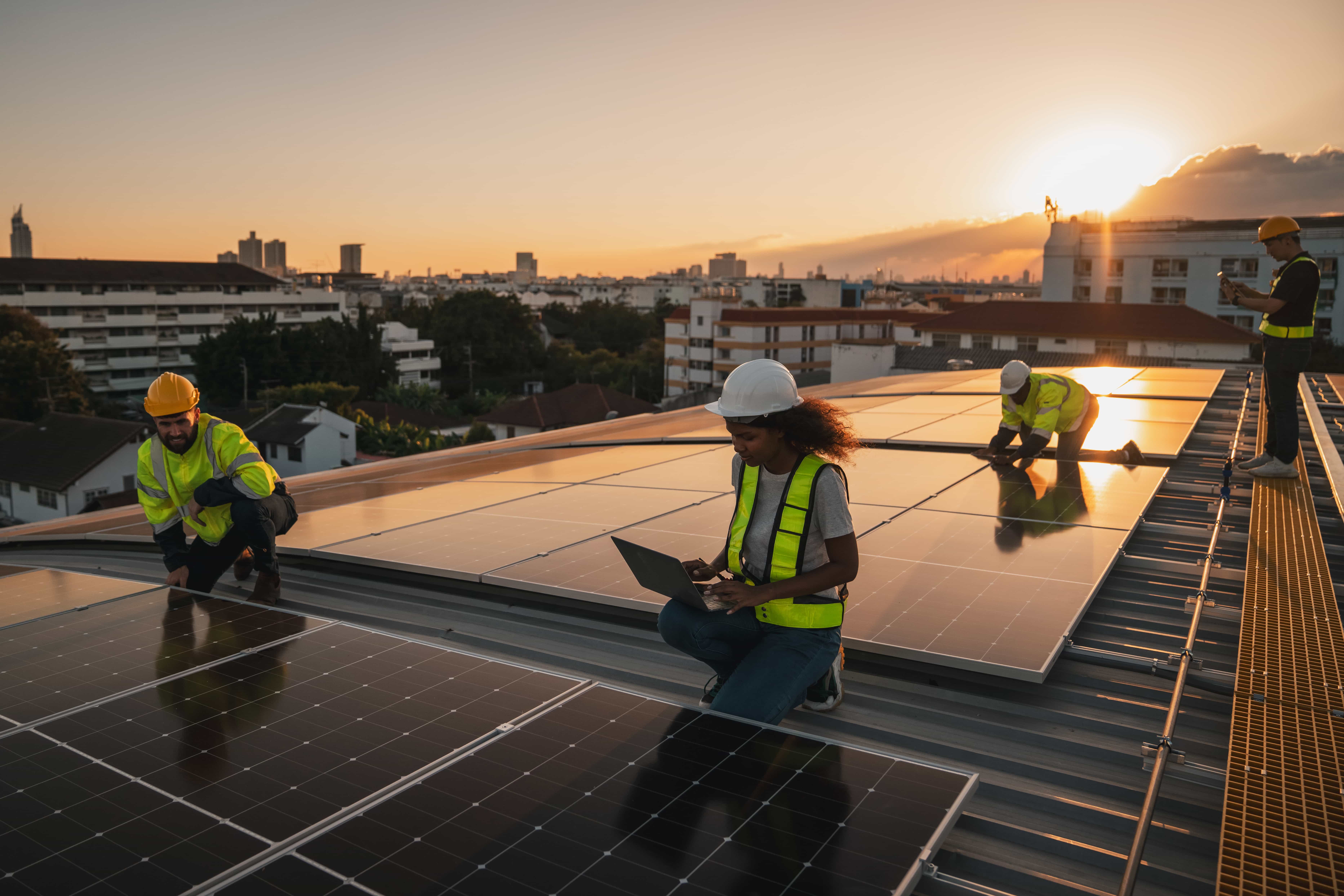 Service engineer checking solar cell on the roof for maintenance if there is a damaged part.