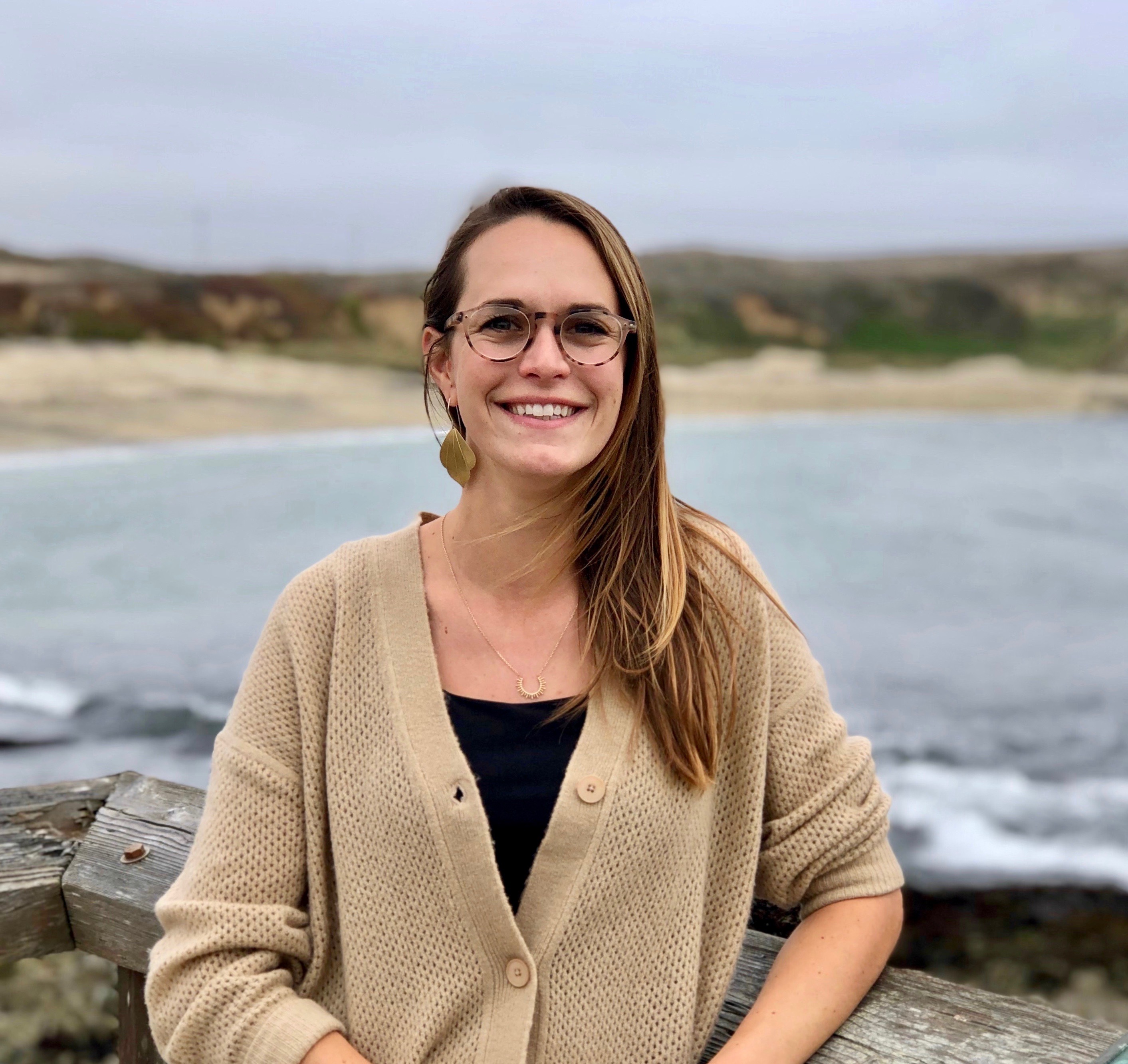 Melissa Ward stands in front of the ocean