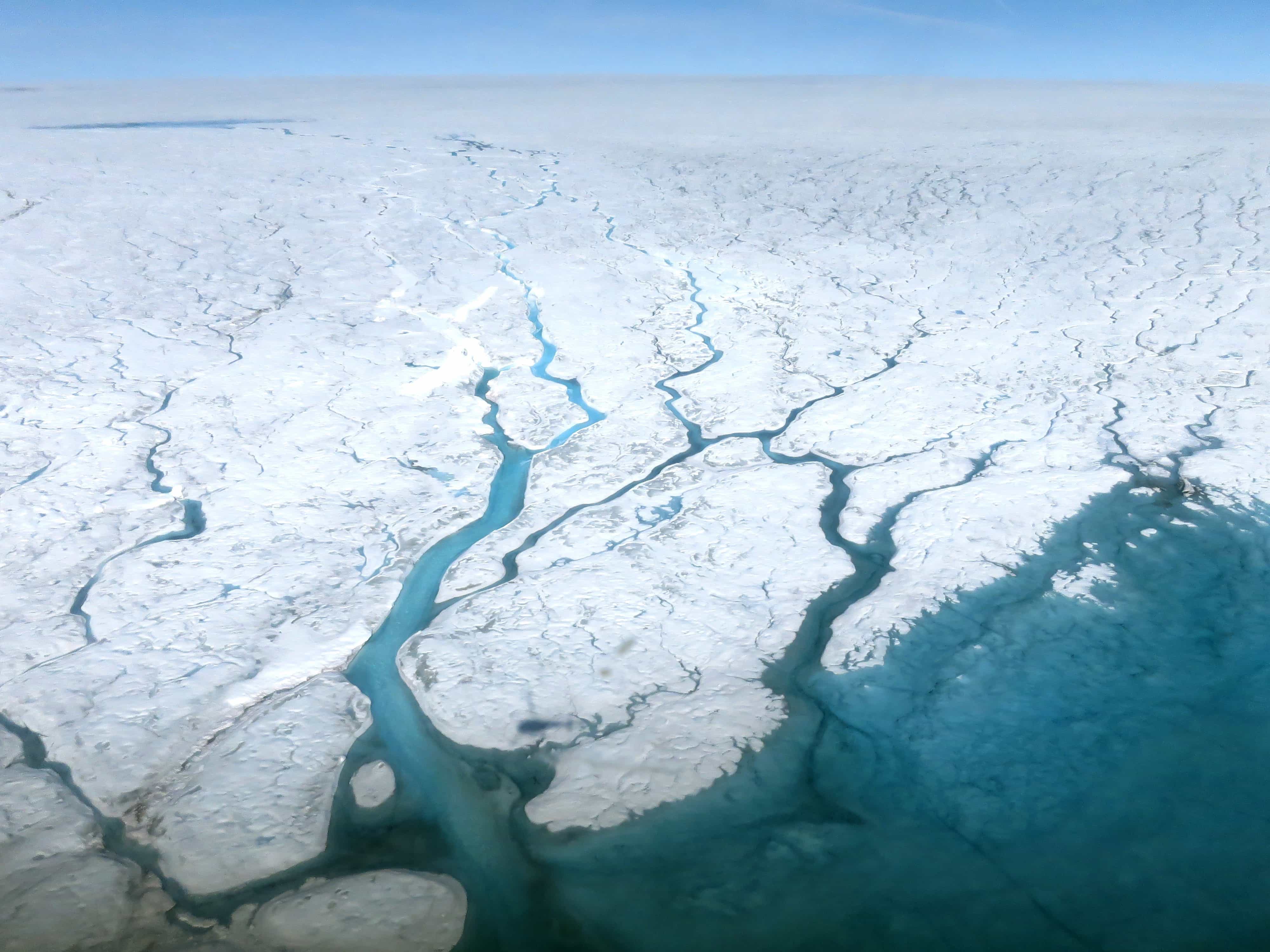  Meltwater runs across the Greenland ice sheet in rivers.