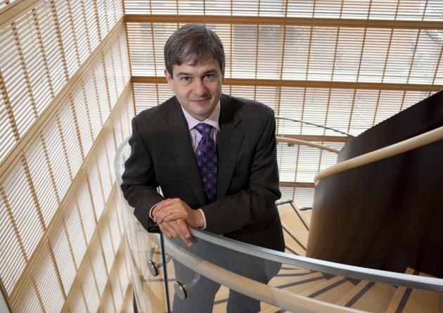 Stephan Ansolabehere stands in a stairwell looking up