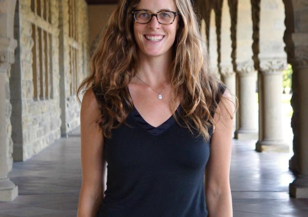 Lauren Oakes stands in an archway