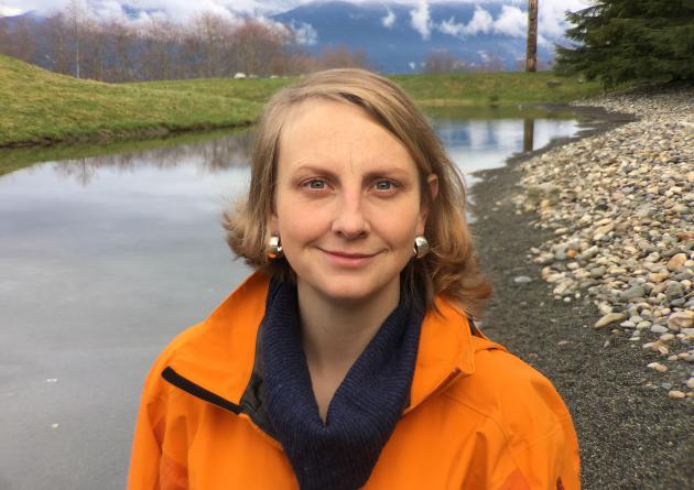 Jennifer Sunday stands in front of a river