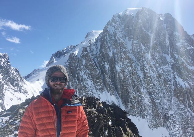 Timbo Stillinger stands on a snowy mountain