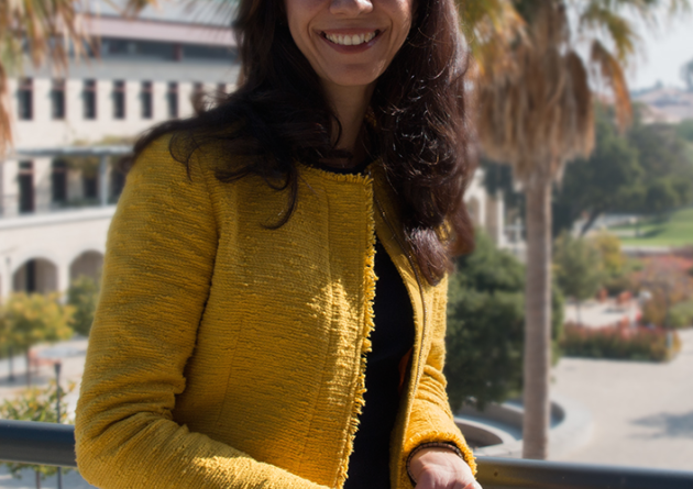 Newsha Ajami stands on a balcony