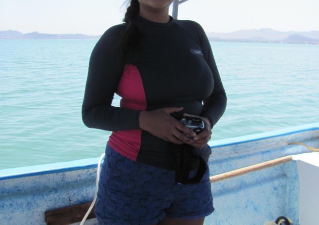 Nicole Corpuz stands on a boat