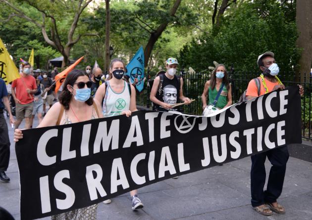 Climate justice march holding banner