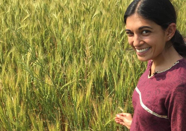 Meha Jain stands in a wheat field