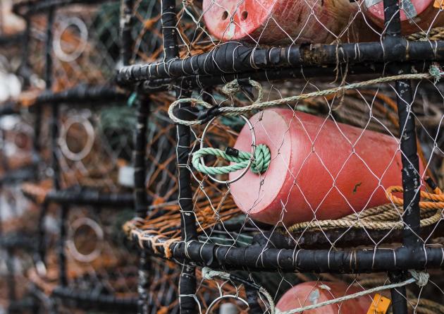 Crab and lobster pots stacked up on the quayside, close up
