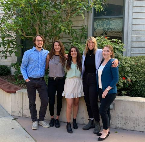 Group of five students posing together