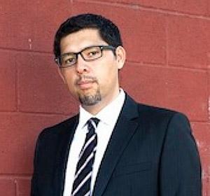 headshot of man in suit