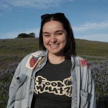 Lily Lucero stands in a field