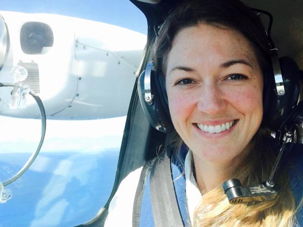 Smiling woman passenger on plane