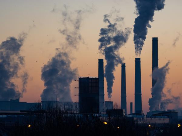 Silhouette of smokestacks