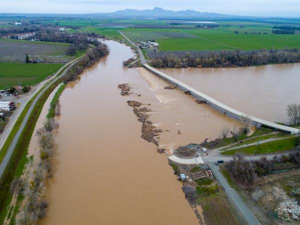 Sacramento River flooded into farmlands and highway