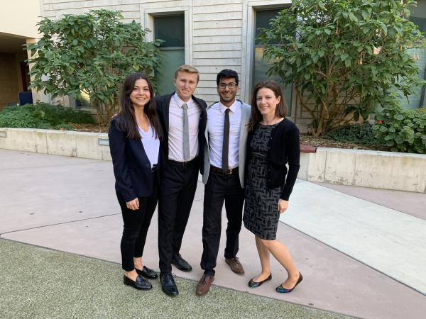 four students posing together