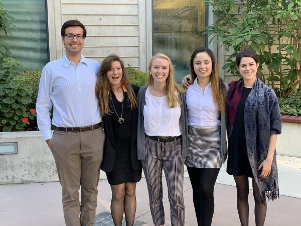 Five students pose together 