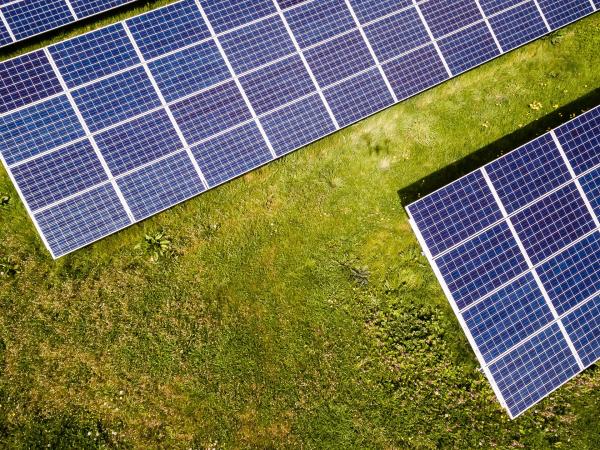 Aerial view of solar panels on grass