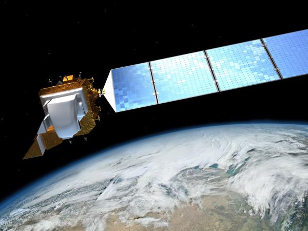 Artist's rendition of a satellite over earth in space