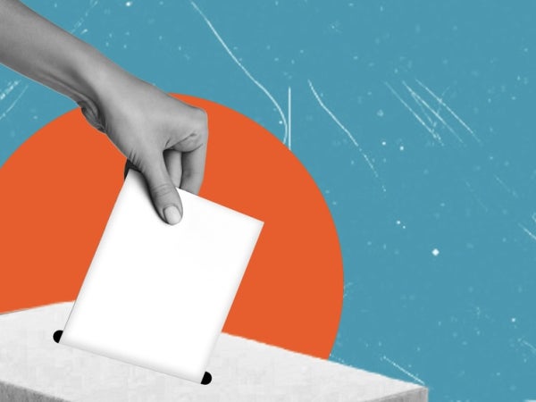A hand places a blank ballot into a ballot box against a stylized background with a large orange circle and a blue, textured sky.